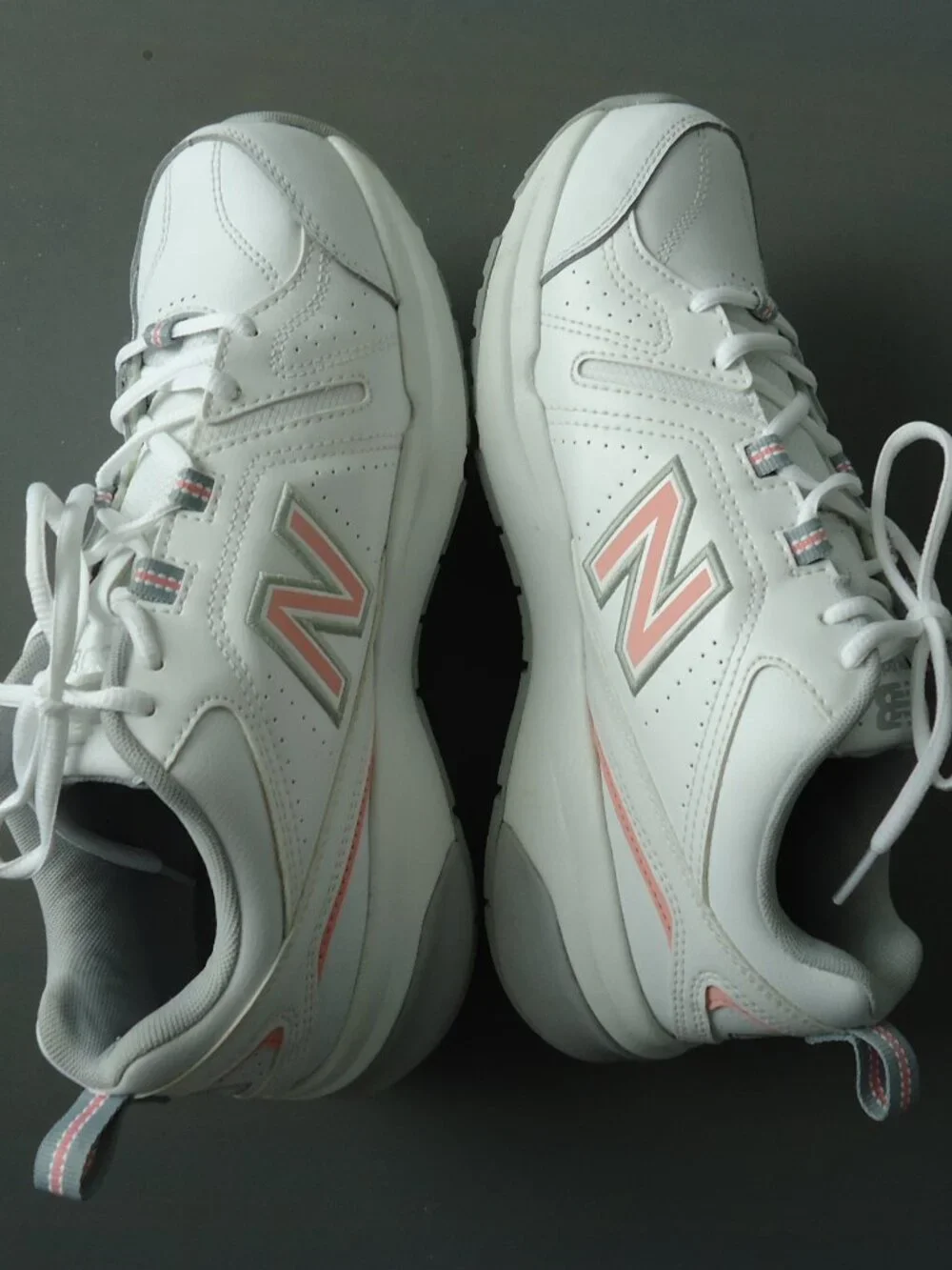 SIZE 9.5. D. New Balance women's white leather sneakers shoes.